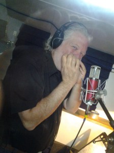 Nashville session musician Mike Douchette lays a harmonica track
